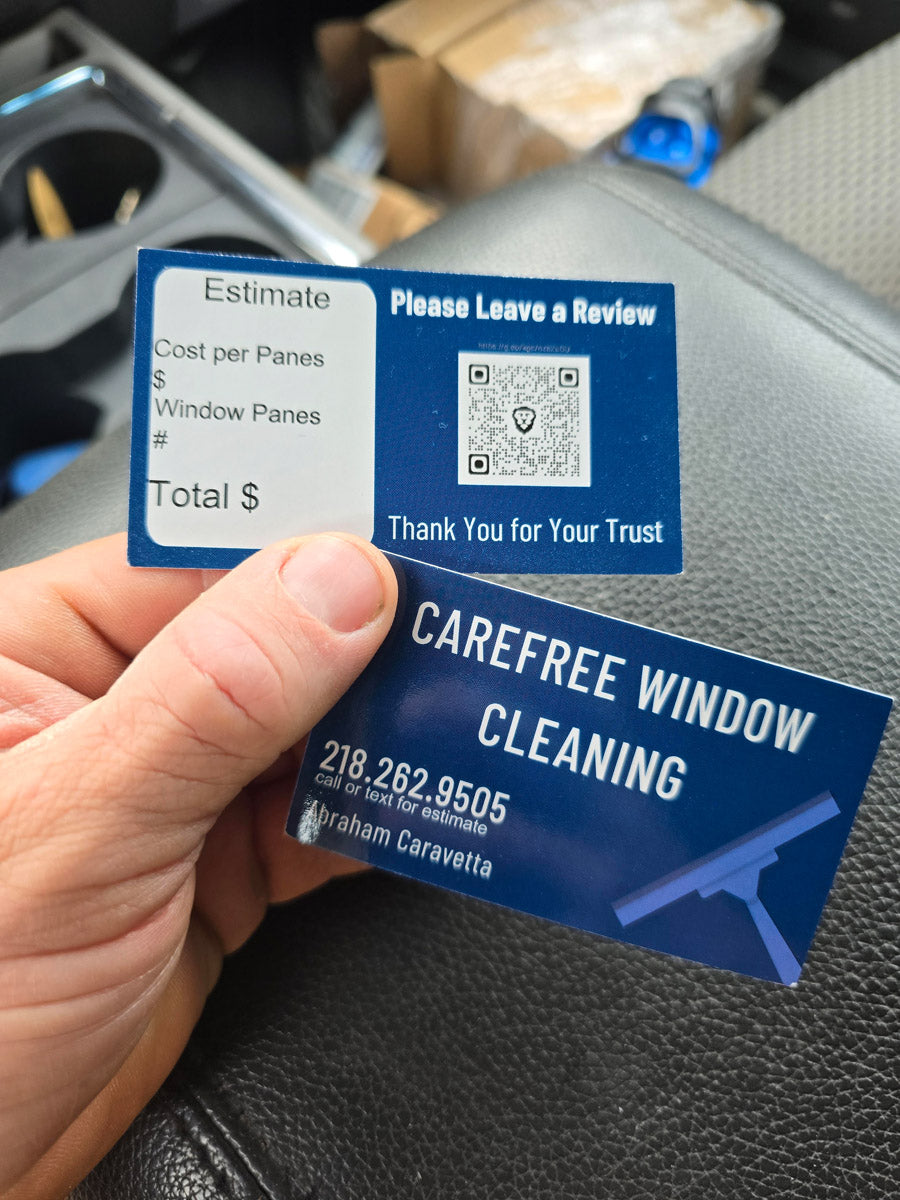 Carefree Window Cleaning double-sided business card with QR code for reviews and estimate section, held inside vehicle, printed by WCR Marketing.