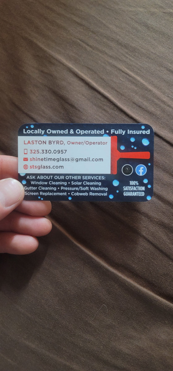 Shine Time Solutions business card for owner Laston Byrd, featuring dark blue background with red squeegee logo and service list, printed by WCR Marketing.