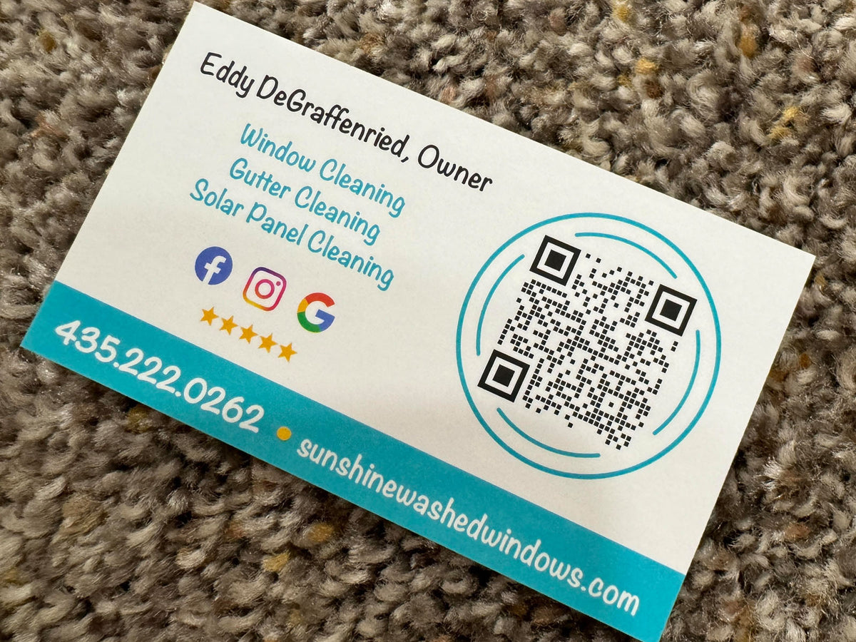 Sunshine Washed Windows business card back featuring QR code, social media icons, and service list for window and solar panel cleaning, printed by WCR Marketing.