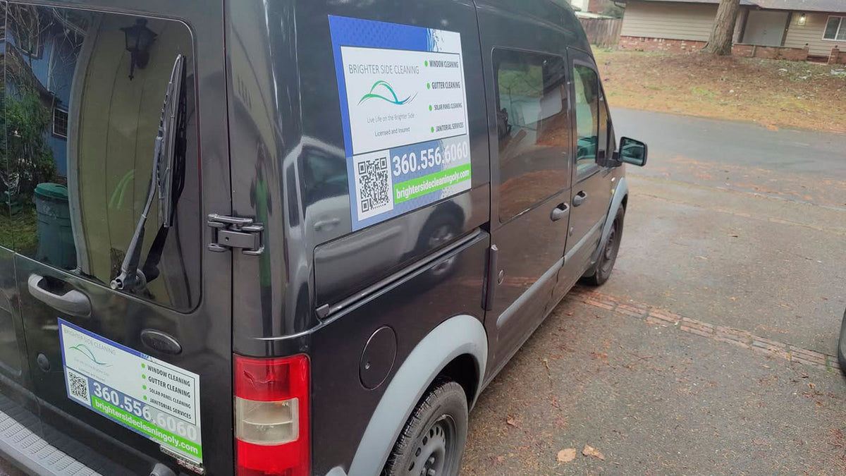 Brighter Side Cleaning service van with large window, gutter, and solar panel cleaning magnets on the rear doors, printed by WCR Marketing.