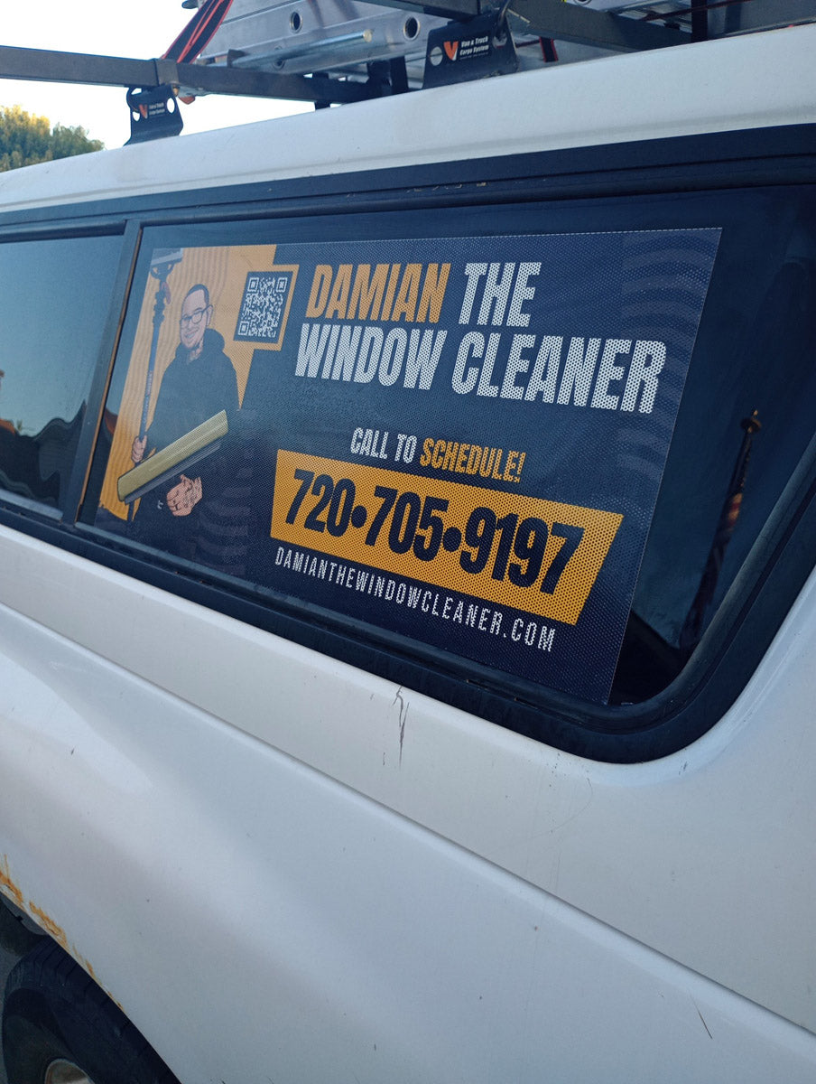 Truck window graphics for Damian The Window Cleaner featuring portrait, logo, and contact information, printed by WCR Marketing.