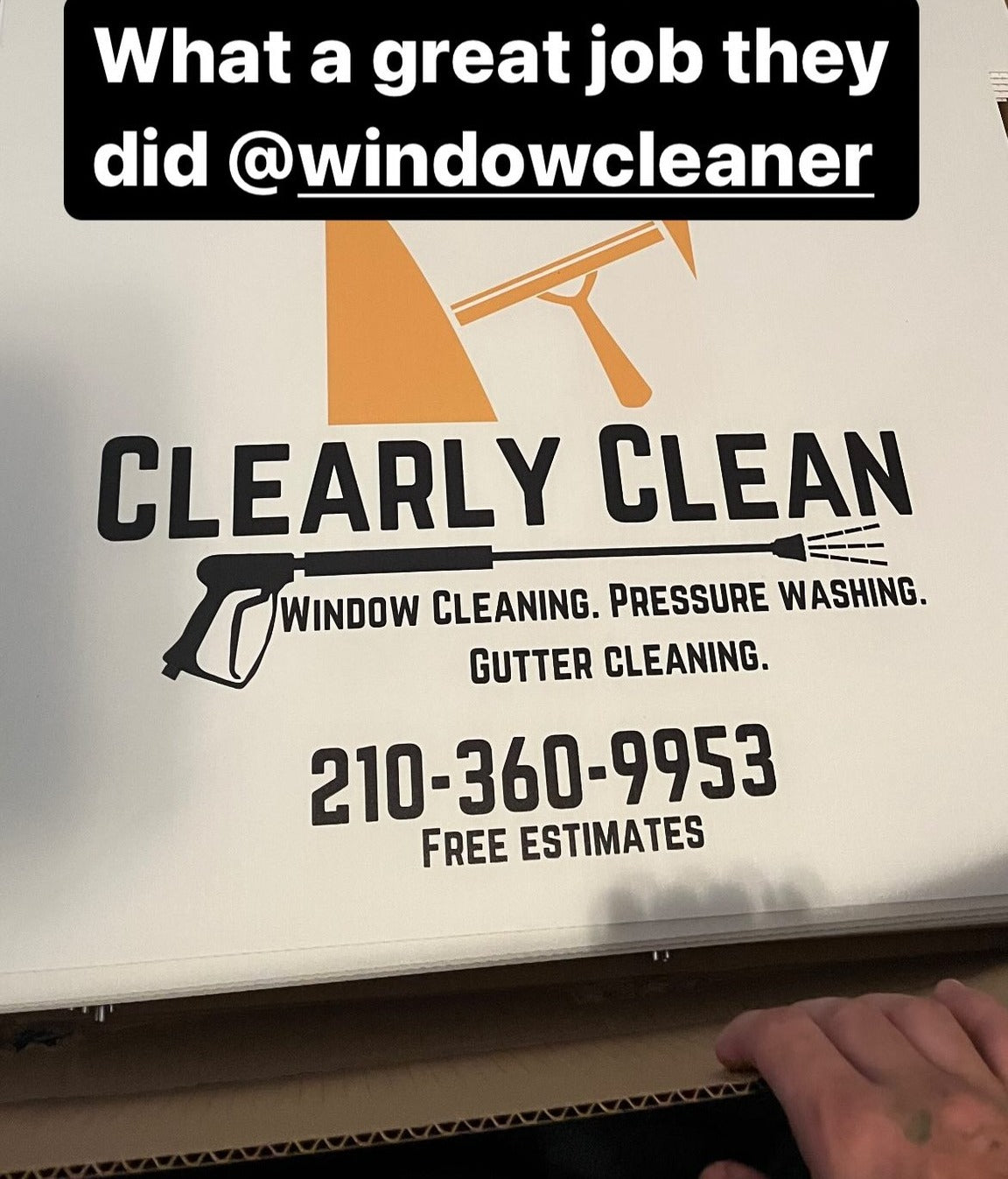 Black and orange yard sign for Clearly Clean featuring window cleaning, pressure washing, and gutter cleaning services, printed by WCR Marketing.
