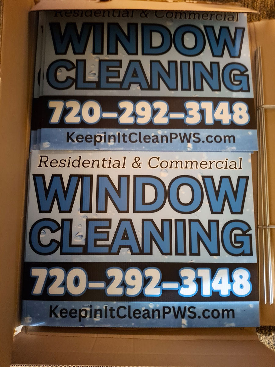 Stack of Keep It Clean PWS yard signs for residential and commercial window cleaning with blue bubble design, printed by WCR Marketing.
