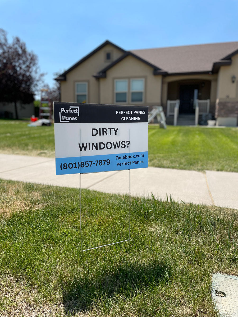 Perfect Panes Cleaning yard sign with Dirty Windows message displayed in front of residential home, printed by WCR Marketing.