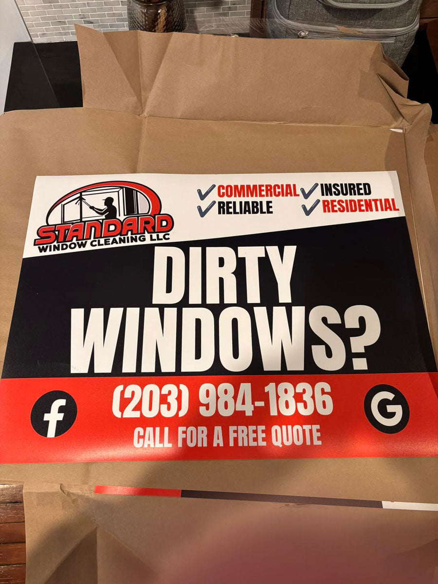 Bold black and red Dirty Windows yard sign for Standard Window Cleaning featuring commercial, residential, and insured service badges, printed by WCR Marketing.