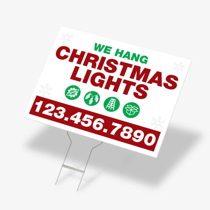Economy yard sign that says “We Hang Christmas Lights” with green icons for installation, ladder, and light bulbs